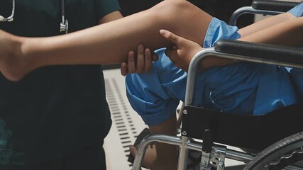 Wall Mural - Male doctor orthopedist examining patient's leg in clinic.