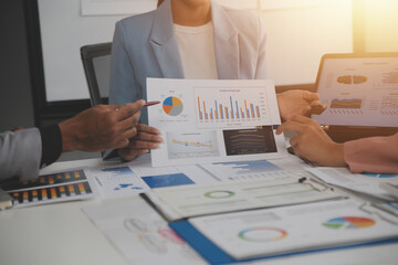 Wall Mural - Close up of Business team analyzing income charts and graphs with modern laptop computer. Business analysis and strategy concept.