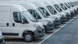 © BISO - A row of white delivery vans parked neatly in a large parking area. The vans belong to a transporting service company.