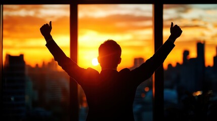 A silhouette of a person celebrating a sunset view from a tall building, symbolizing achievement and fulfillment.