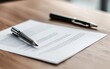 © JP STUDIO LAB - A close-up of a business contract laid out on a wooden desk with a pen ready to sign