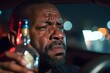 © Matija - black man in tears with a bottle of alcohol in a car