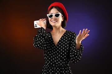 Sticker - Stylish woman listening to voice message via smartphone on color background