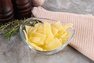 Wall Mural - Parmesan cheese slices in the bowl