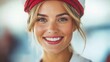 © Viktor - A cheerful young woman in a red and white hat smiles warmly, captivating the atmosphere around her