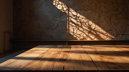 Wall Mural - empty dark wooden table with abstract light from leaf shadow on the wall