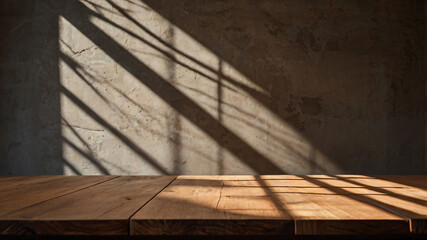Wall Mural - empty dark wooden table with abstract light from leaf shadow on the wall