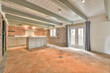 © ADDICTIVE STOCK - Renovated kitchen with brick walls and terracotta tiles