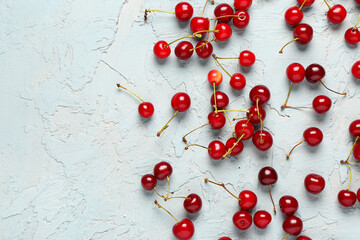 Canvas Print - Many red sweet cherries on blue background