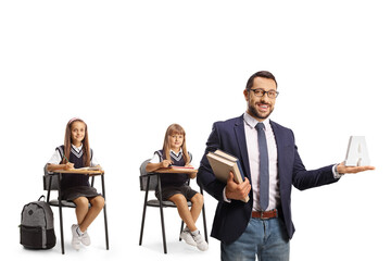 Canvas Print - Schoolchildren sitting in chairs and male teacher holding a letter