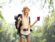© Ljupco Smokovski - Female tourist holding a passport