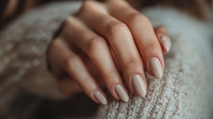 Closeup to woman hands with elegant neutral colors