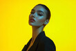 © Blockbits - Woman in Black Suit with Solid Neon Yellow Stylish Portrait Featuring Vibrant Neon Yellow Background