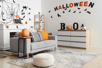 Sticker - Interior of light living room decorated for Halloween with sofa and drawers