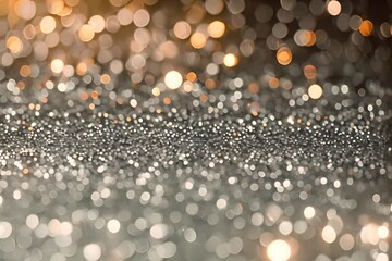 Abstract silver glitter background with bokeh lights.