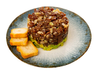 Wall Mural - Delicious tuna fish tartare served on plate for appetizer. Isolated over white background