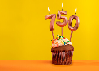 Candle with flame number 750 - Anniversary card on yellow background