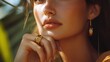 © Nicat - A natural stone ring on the finger of a sophisticated woman. The female model wears a sophisticated gold ring on her finger. Pictures of jewelry for e-commerce, social media, and other platforms