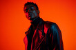© Blockbits - Mens Dark Red Leather Jacket with Neon Orange, Lifestyle Portrait, Fashion Background, Bold, Stylish, and Contemporary Look