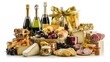© F - Luxuriously arranged gift hamper featuring fine wine bottles, wrapped gifts, and designer decorations in a wicker basket. Perfect for festive celebrations, elegant gift-giving, and special occasions