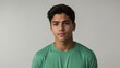 © Alteisen Riese - teen stunning brunette hispanic man with green shirt model portrait standing straight on a plain white background for ad concept space for text