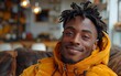 © peacehunter - Relaxed Young Man Smiling Indoors in Cozy Modern Home with Warm Lighting and Stylish Decor