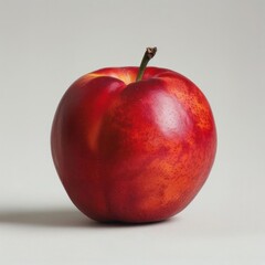 A vibrant, juicy red apple ready for consumption.