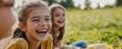 © SITTAKAN - Happy expressions after a minor spill during a picnic, capturing the light-hearted fun, close-up, whimsical, fusion, grassy field backdrop
