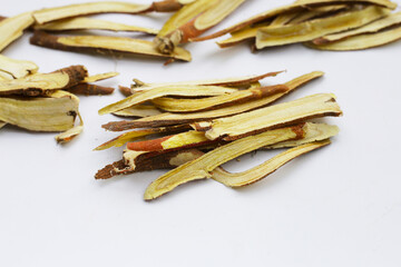 Liquorice sliced on white background.