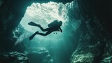 scuba diver circling a cave