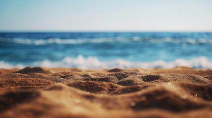 Poster - Sandy shoreline with a blurred ocean backdrop