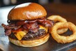 © PinkiePie - A BBQ bacon cheeseburger with melted cheddar, crispy bacon, and barbecue sauce, served with onion rings