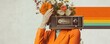 © Georgii - Creative surreal portrait of woman with retro radio and floral head in orange suit