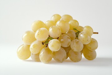 A bunch of grapes are sitting on a white background