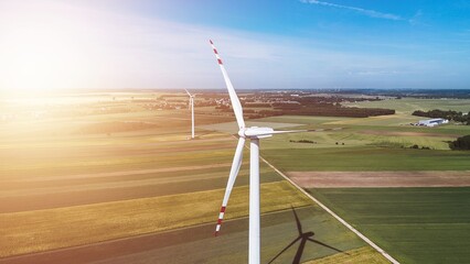 Wall Mural - Wind turbine in fields illustrating sustainable future and wind power