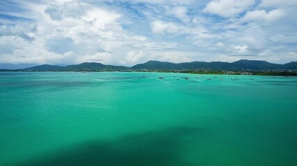 Wall Mural - Aerial view hyperlapse of beautiful sea in summer season landscape view sea background,Phuket island Thailand,Timelapse shadow clouds over sea and mountains landscape