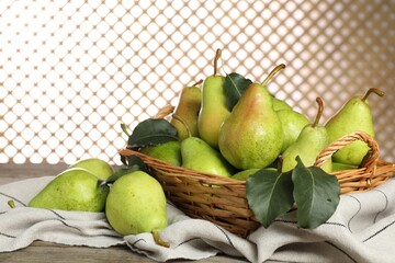 Wall Mural - Fresh green pears and leaves on wooden table, closeup