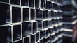 © photolas - Cross-sectional view of several square steel tubes with a metallic sheen.