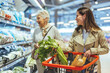 © Dragana Gordic - Smiling Women Shopping for Fresh Vegetables at the Supermarket