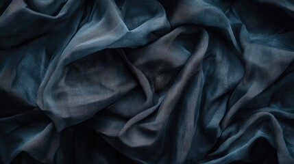 Poster - A close-up of dark blue, flowing fabric creating a textured, elegant appearance.