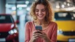 © yusufadi - Smiling Woman Using Phone in Showroom
