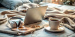 © Joesunt - Cozy Work Haven: Laptop, coffee, and headphones rest on a bed adorned with soft blankets, embodying the comfort of a home office.