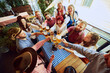 © master1305 - Group of cheerful people, friends, men and women sitting at local pub, drinking beer and having relaxing weekend. Concept of Oktoberfest, festival, party, brewery, traditions