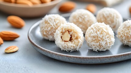 Wall Mural - coconut-coated almond balls placed neatly on a gray ceramic plate, Generative AI