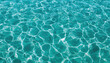 © Oranuch - Crystal clear turquoise water with sunlit ripples, perfect for evoking tranquility, serenity, and relaxation in your projects.
