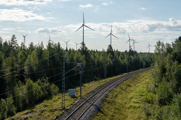 Wall Mural - A windfarm and railroad in Northern Finland