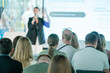 © Anton Gvozdikov - Audience members attentively listen to a speaker at a business seminar discussing various topics and strategies.