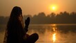 © aimodels24 - Silhouette of a Woman Offering Prayers to the Rising Sun During Chhath Puja by the River with Warm Golden Tones and a Serene Atmosphere