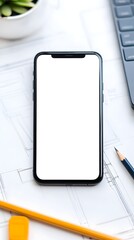 Smartphone with Blank Screen on Architectural Desk - Close-up of mobile phone with blank display