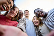 © CarlosBarquero - Selfie portrait international Gen z friends group looking excited at camera sunny day outdoors. Young student people posing laughing embracing together standing happy enjoying university holidays